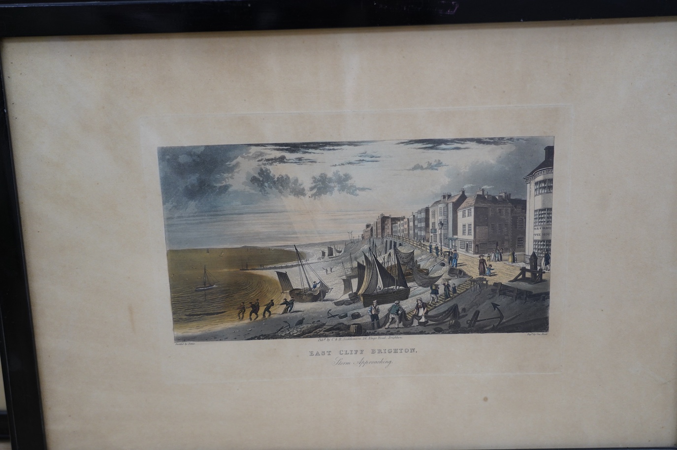 Four 19th century, hand coloured engravings, Brighton views including ‘East Cliff, Brighton, Storm Approaching’, published by C & R Sicklemore, and ‘The Battery, Brighton’, 32 x 48cm. Condition - poor